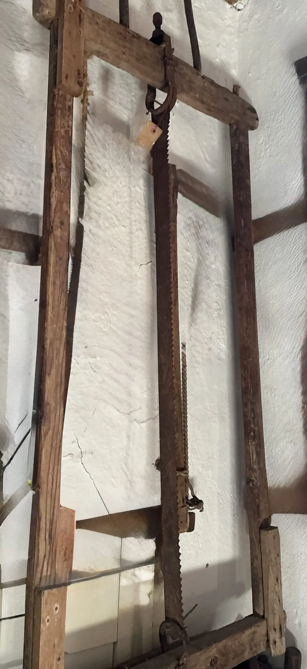 Antique wooden frame saw with vertical blade