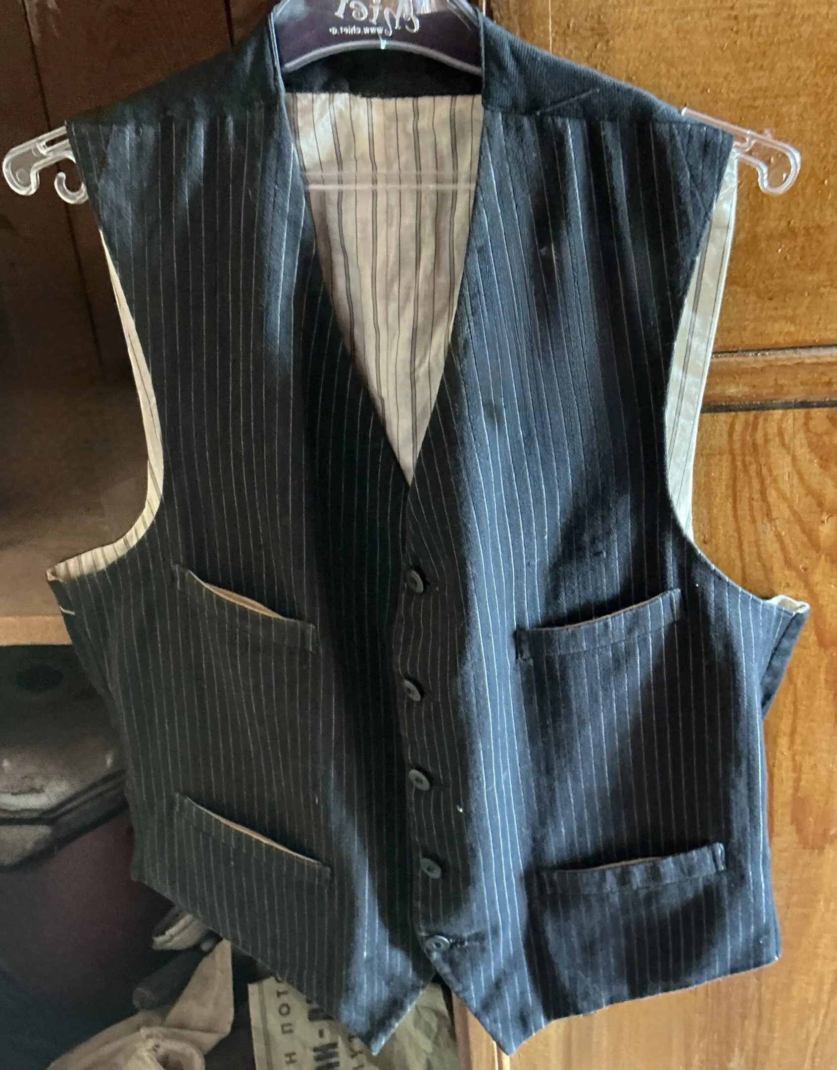 Classic black pinstripe vest on hanger